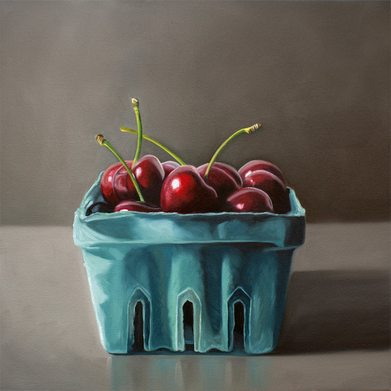 This artwork features a turquoise blue basket of fresh red cherries.
