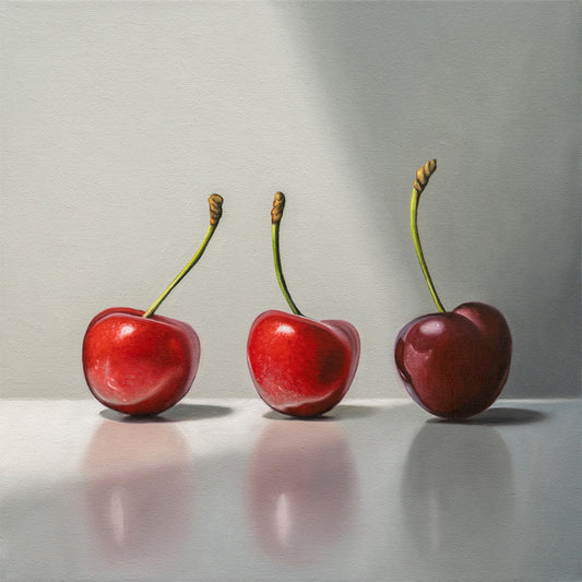 This painting features a trio of cherries in varied lighting on a reflective surface.