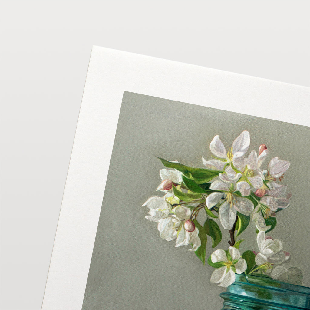 This artwork features a vintage blue jar filled with white crabapple blossoms.