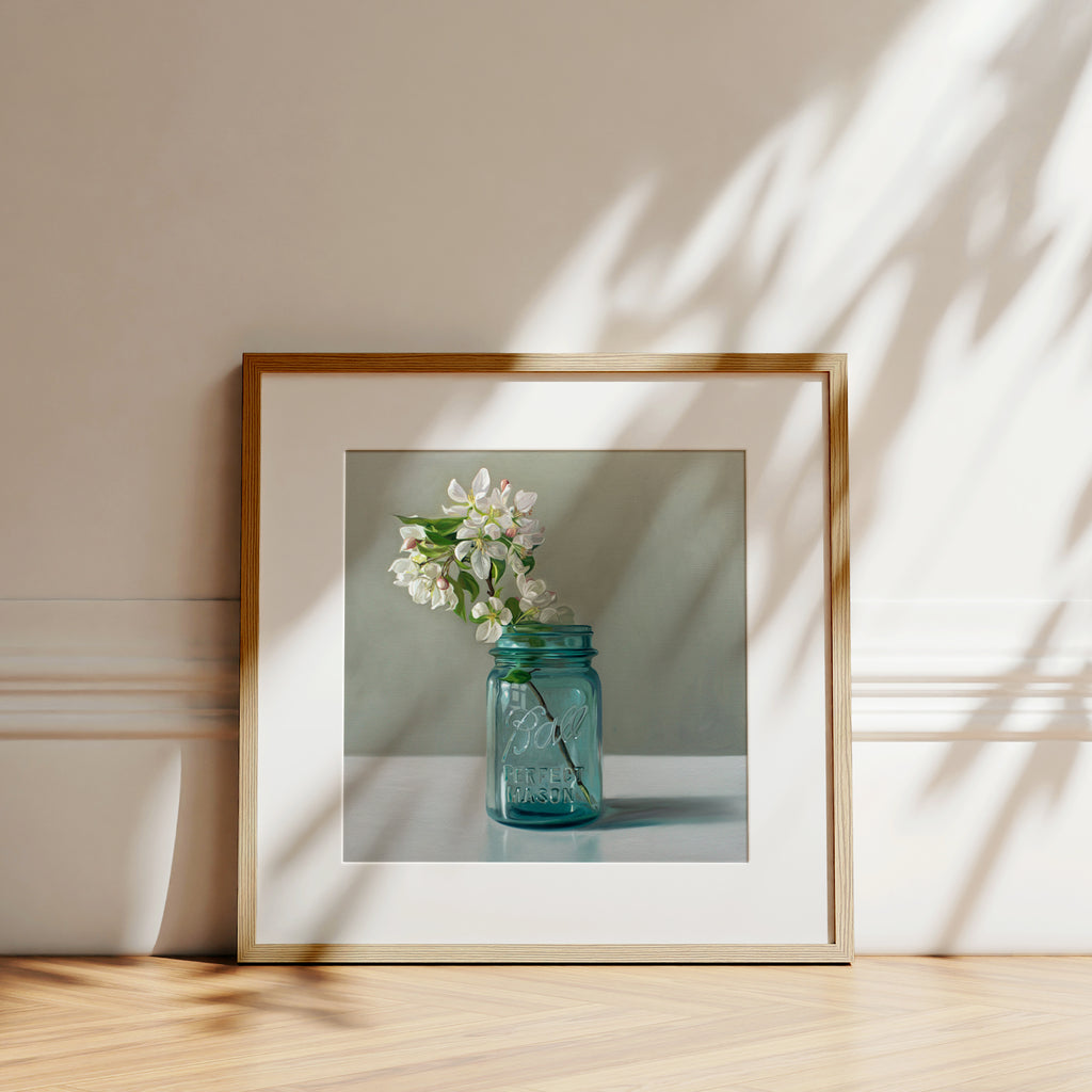 This artwork features a vintage blue jar filled with white crabapple blossoms.