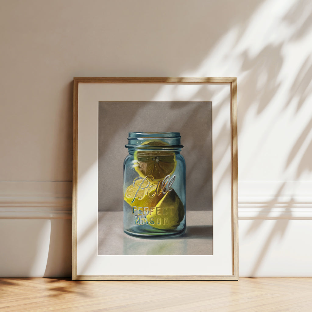This artwork features a vintage turquoise jar containing a trio of lemon halves.