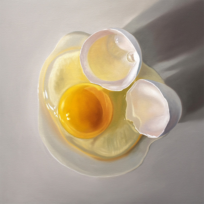 This artwork features a cracked egg resting on a light grey surface with some nice dramatic lighting.