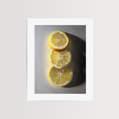 This artwork features a trio of lemon slices situated on a light grey surface with some nice dramatic side lighting.