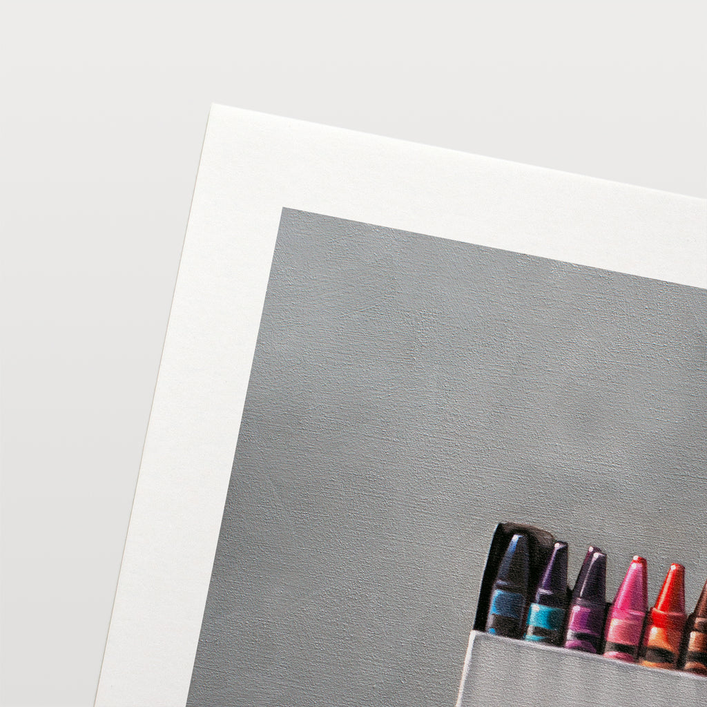 This artwork features a simple white box of crayons resting on a light reflective surface.