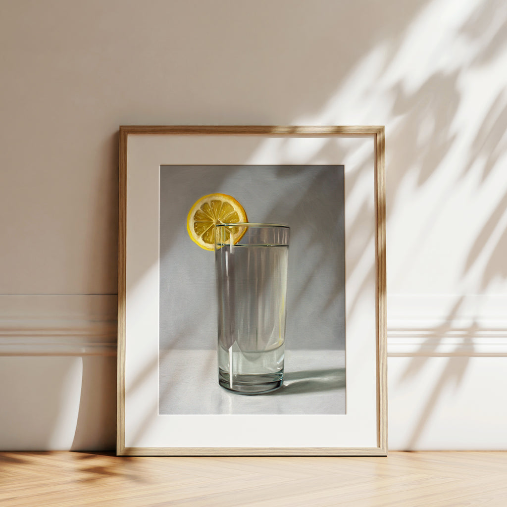 This artwork features a glass of water with a lemon slice resting on a light grey surface with dramatic lighting.