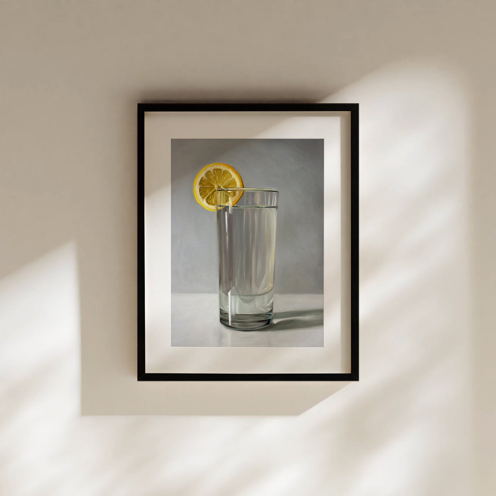 This artwork features a glass of water with a lemon slice resting on a light grey surface with dramatic lighting.