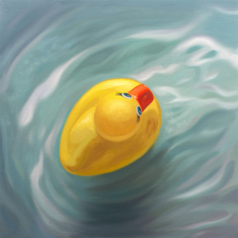 This artwork features a single rubber ducky floating in blue rippled water from above.