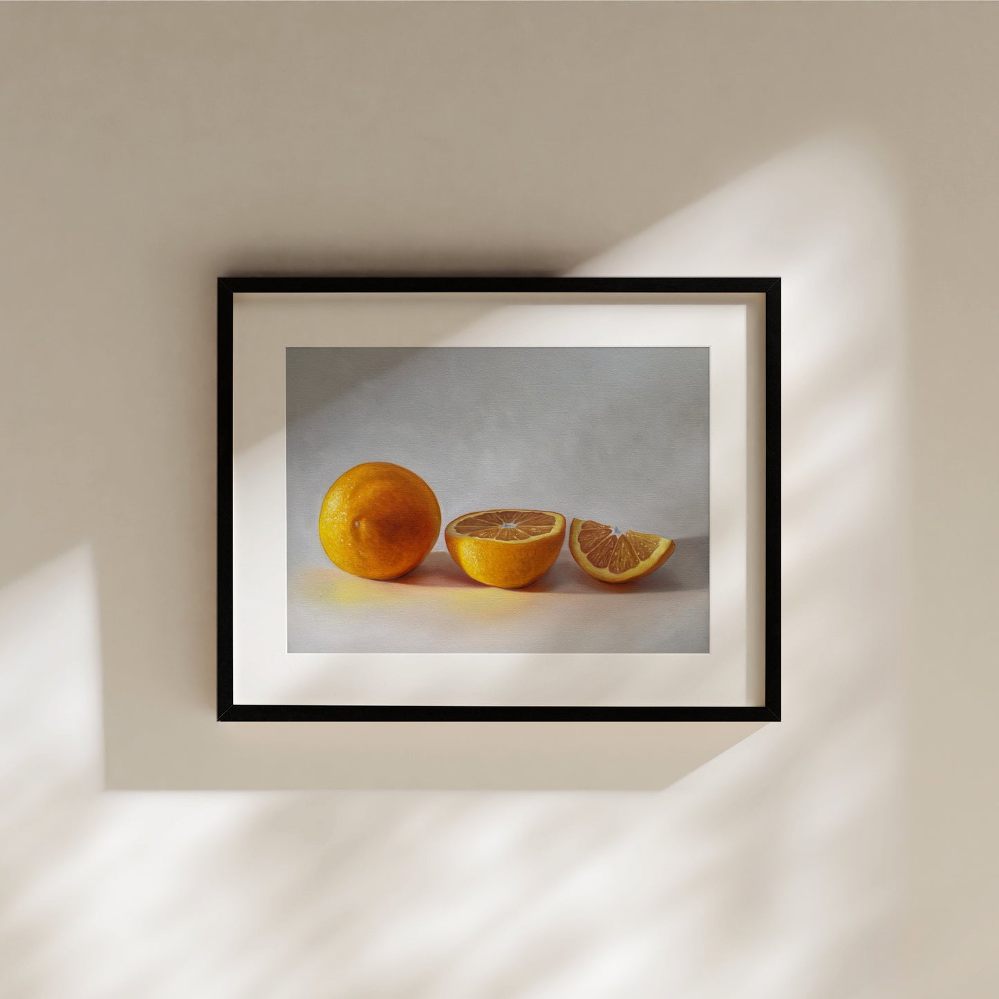 This artwork features a whole orange, half orange, and quarter slice of an orange resting on a light surface.