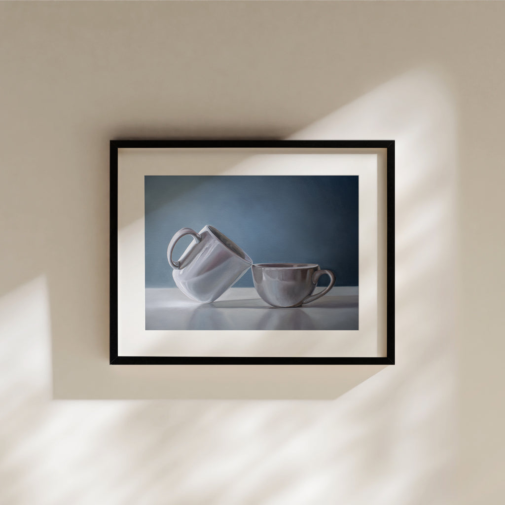 This artwork features a pair of coffee cups with resting on a reflective surface with a neutral blue background.