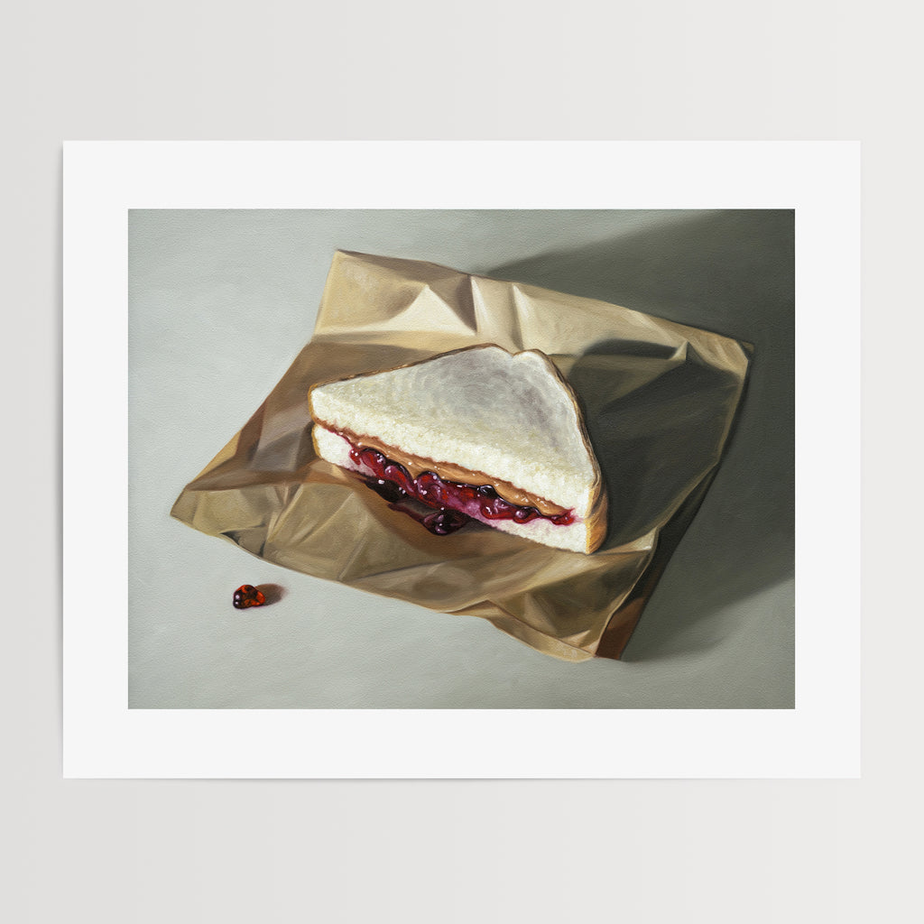 This artwork features an ooey gooey peanut butter and jelly sandwich resting on a crumped piece of brown parchment paper.