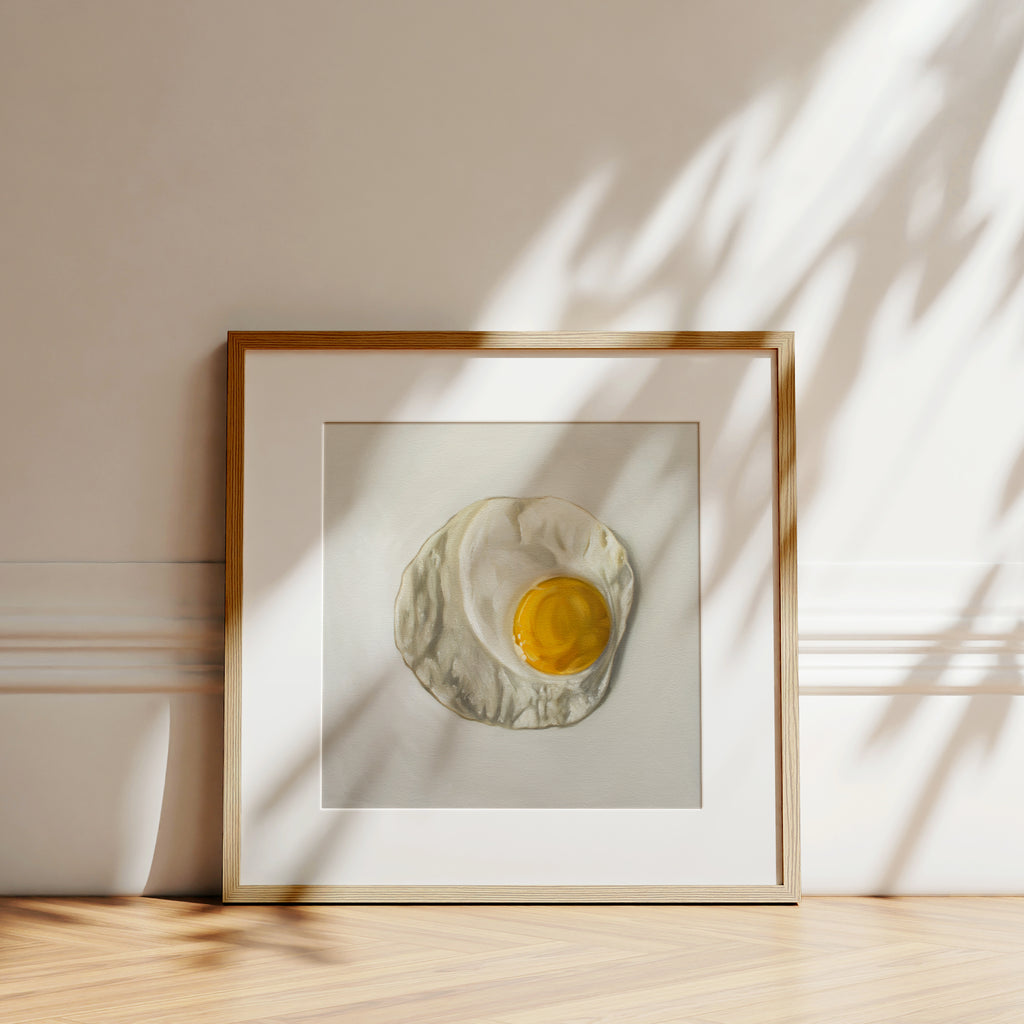 This artwork features a freshly fried egg.