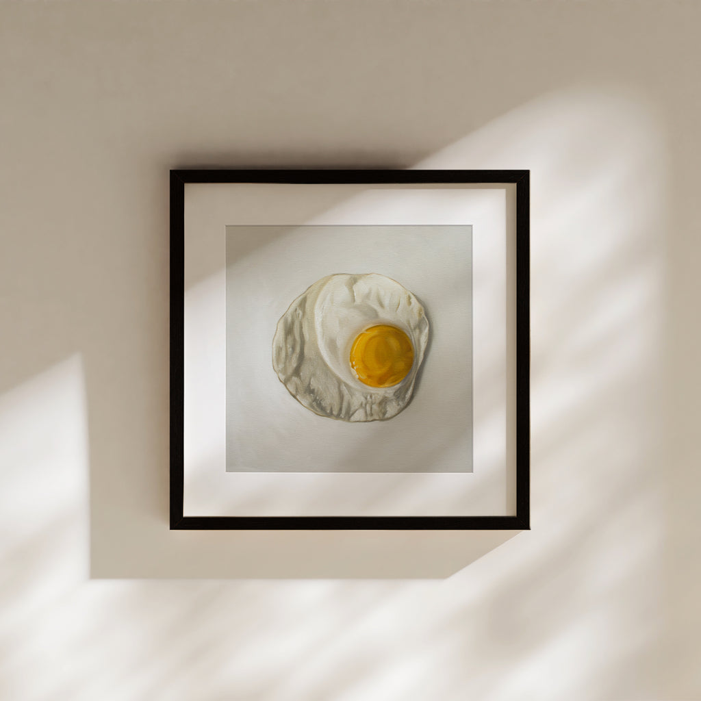 This artwork features a freshly fried egg.