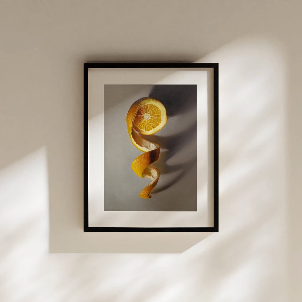 This artwork features a freshly sliced orange with its peeling spiraling in a downward fashion with dramatic side-lighting creating interesting cast shadows.