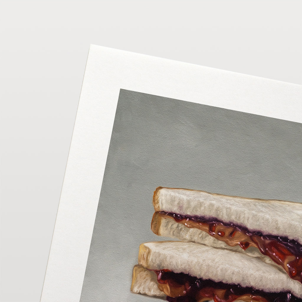 This artwork features a stacked peanut butter and jelly sandwich resting on a neutral grey surface.