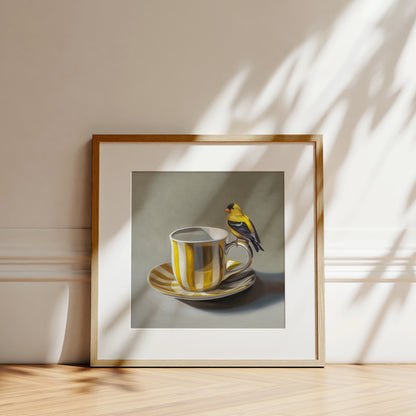 This artwork features an American Goldfinch perched on the handle of a whimsical yellow and white striped cup with saucer.