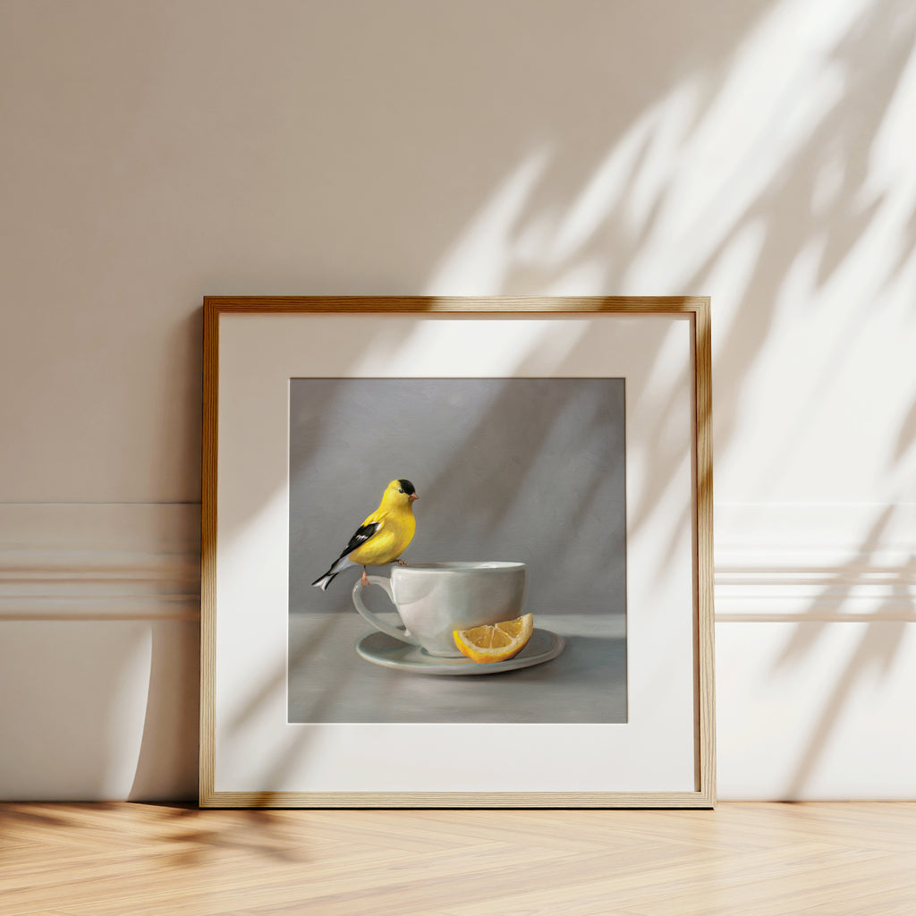 This artwork features an American Goldfinch perched on a cup of lemon tea.This artwork is from a series of paintings that I am working on featuring birds and beverages.