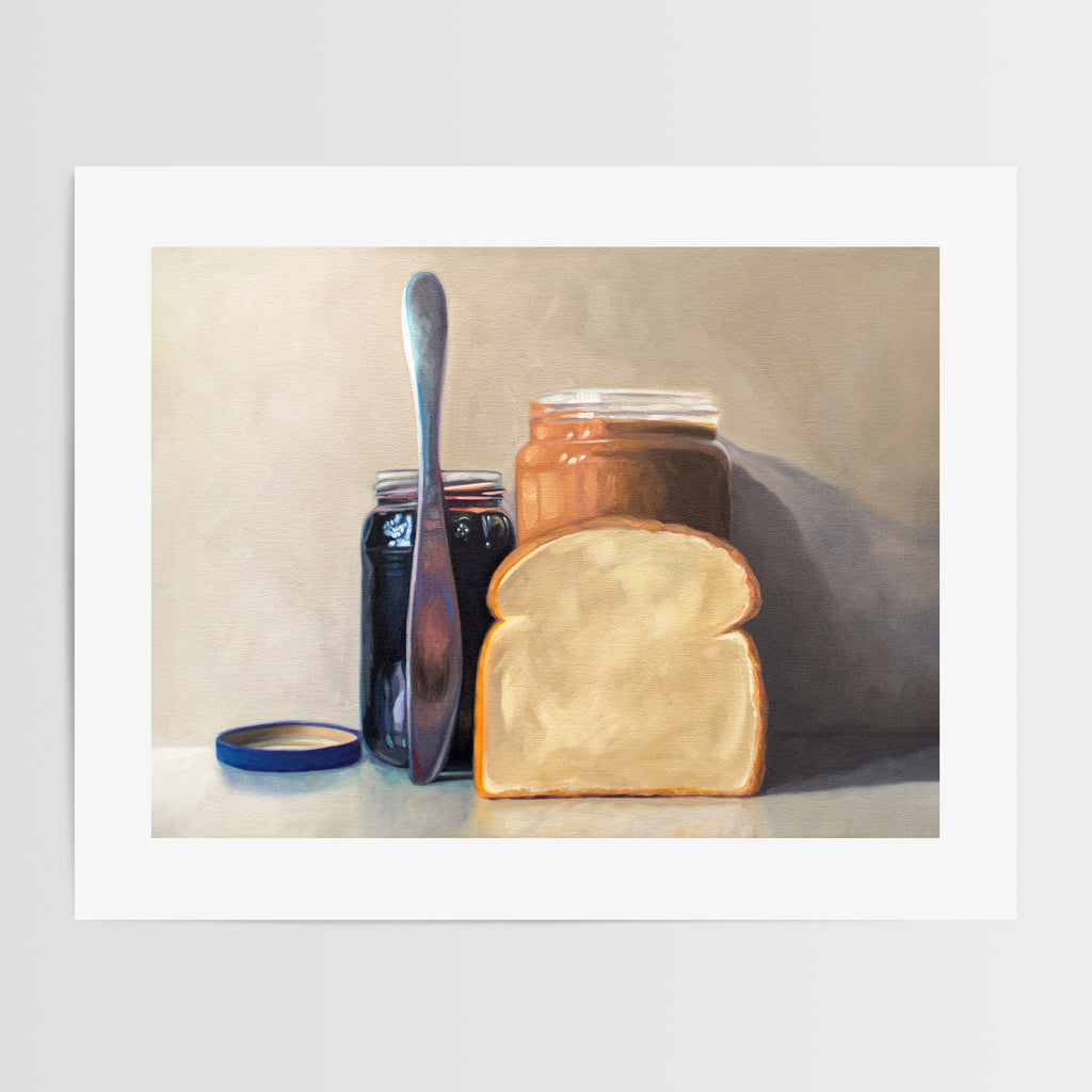 This artwork features all the things required to make a peanut butter and jelly sandwich lined up and ready to go on a light and neutral backdrop with subtle reflections.