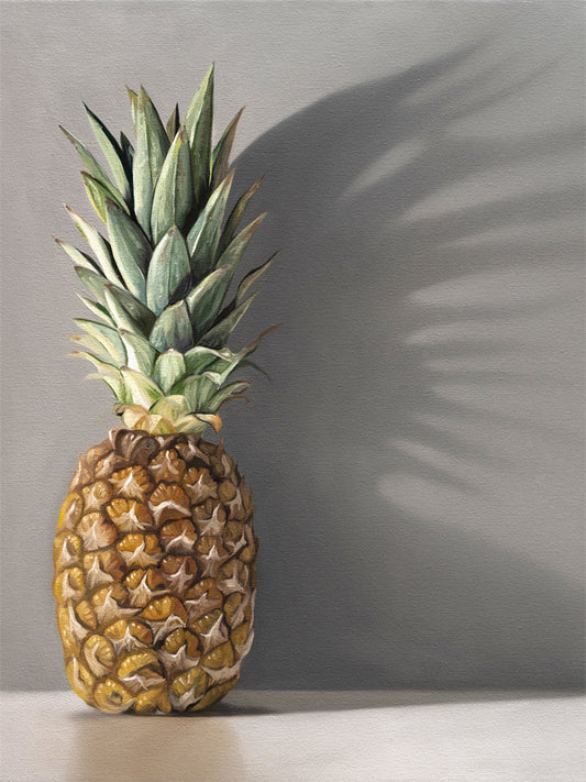 This artwork features a pineapple resting directly in front of a neutral grey wall with dramatic side-lighting creating interesting cast shadows.