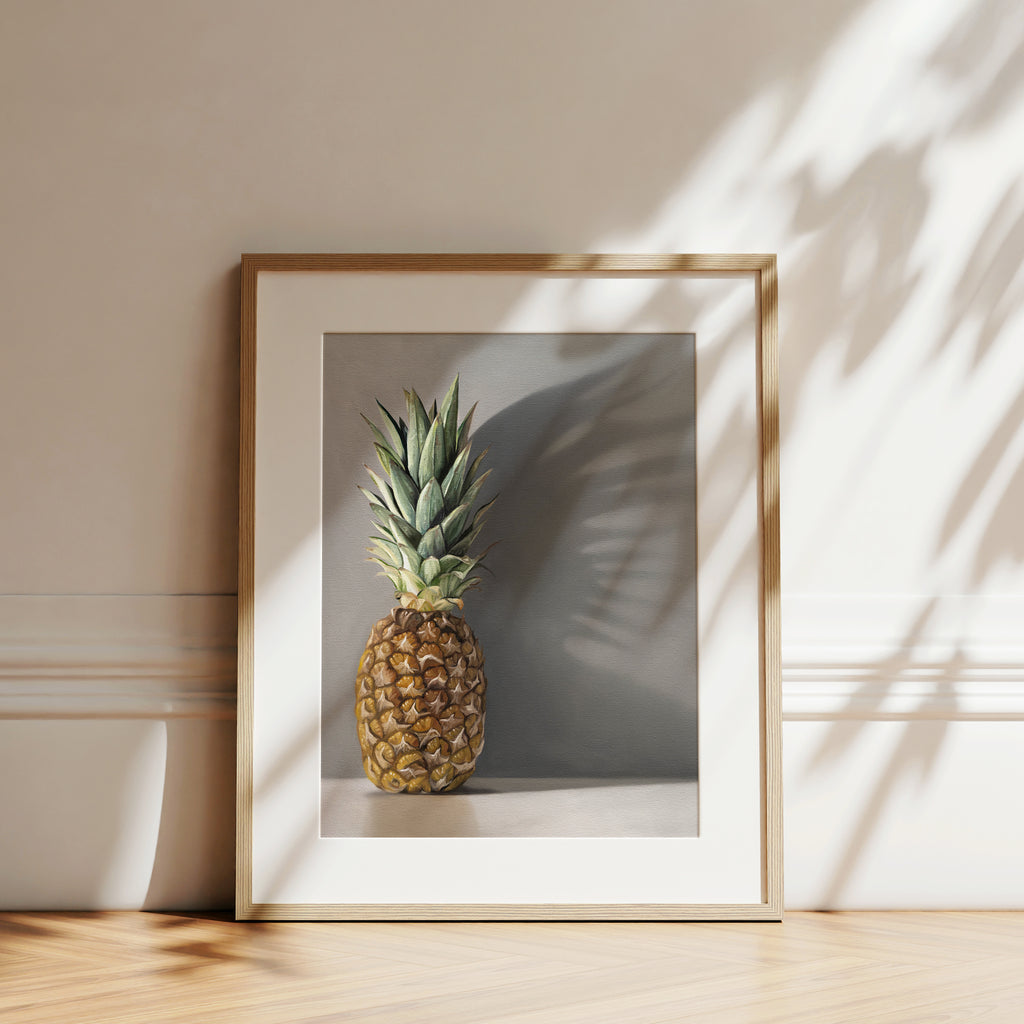 This artwork features a pineapple resting directly in front of a neutral grey wall with dramatic side-lighting creating interesting cast shadows.