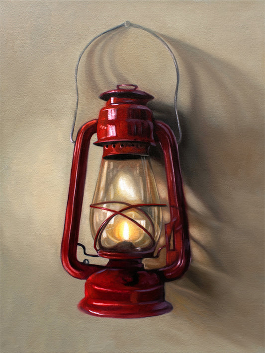 A vintage red lantern hangs from a single nail and casts a variety of interesting light and shadows upon the wall.