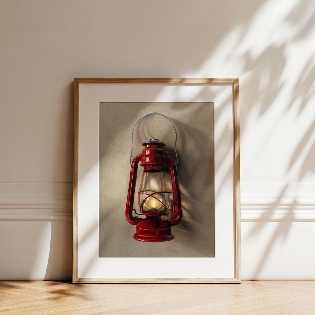 A vintage red lantern hangs from a single nail and casts a variety of interesting light and shadows upon the wall.