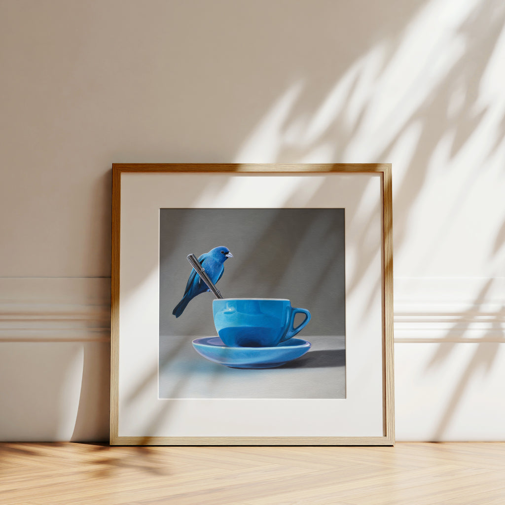 This artwork features an Indigo Bunting perched on the handle of a spoon resting on the edge of a blue cup with saucer.