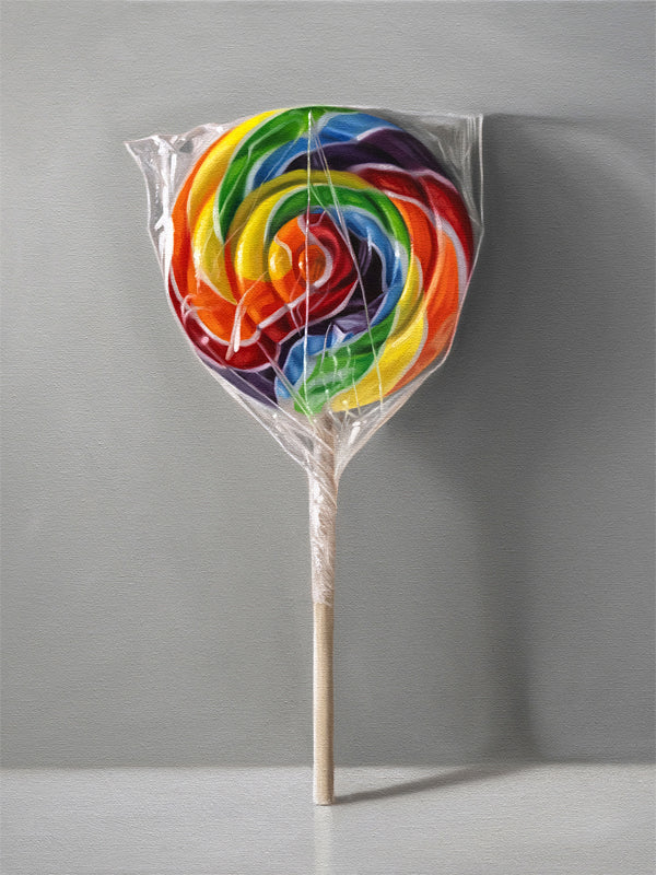 This artwork features a rainbow swirl lollipop leaning on a neutral grey wall with some nice dramatic lighting.