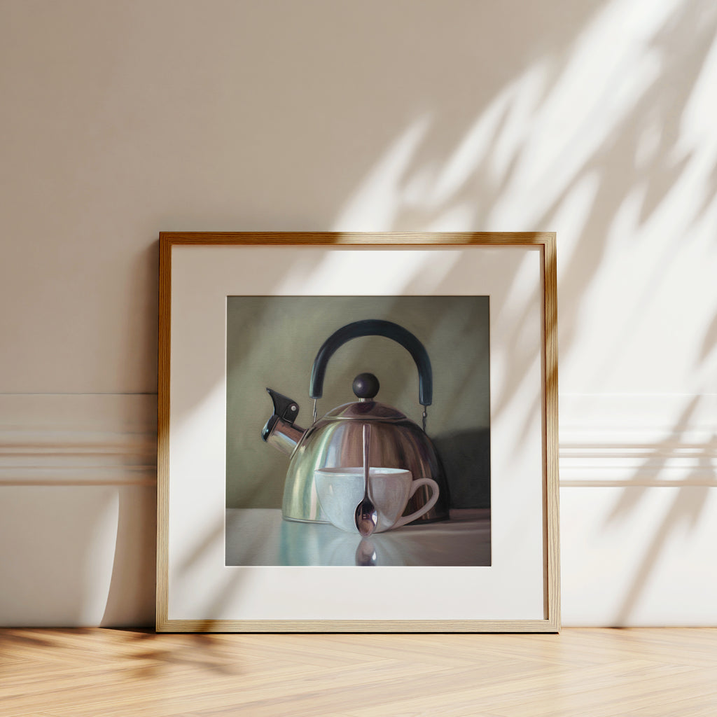 This artwork features a coffee cup resting next to a vintage tea kettle.This artwork is from a series featuring tea kettles paired with various objects.