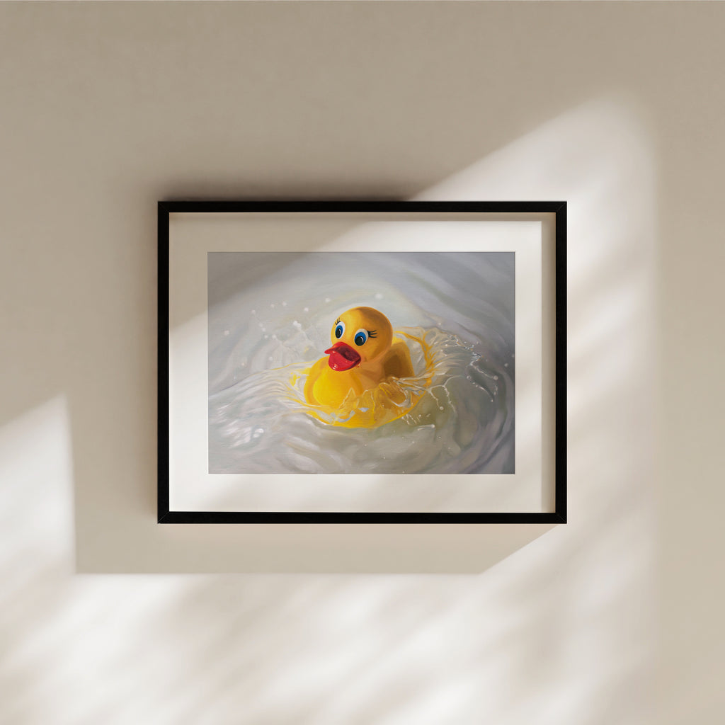 This artwork features a rubber ducky being dropped into a pool of water surrounded by ripples and splashes.