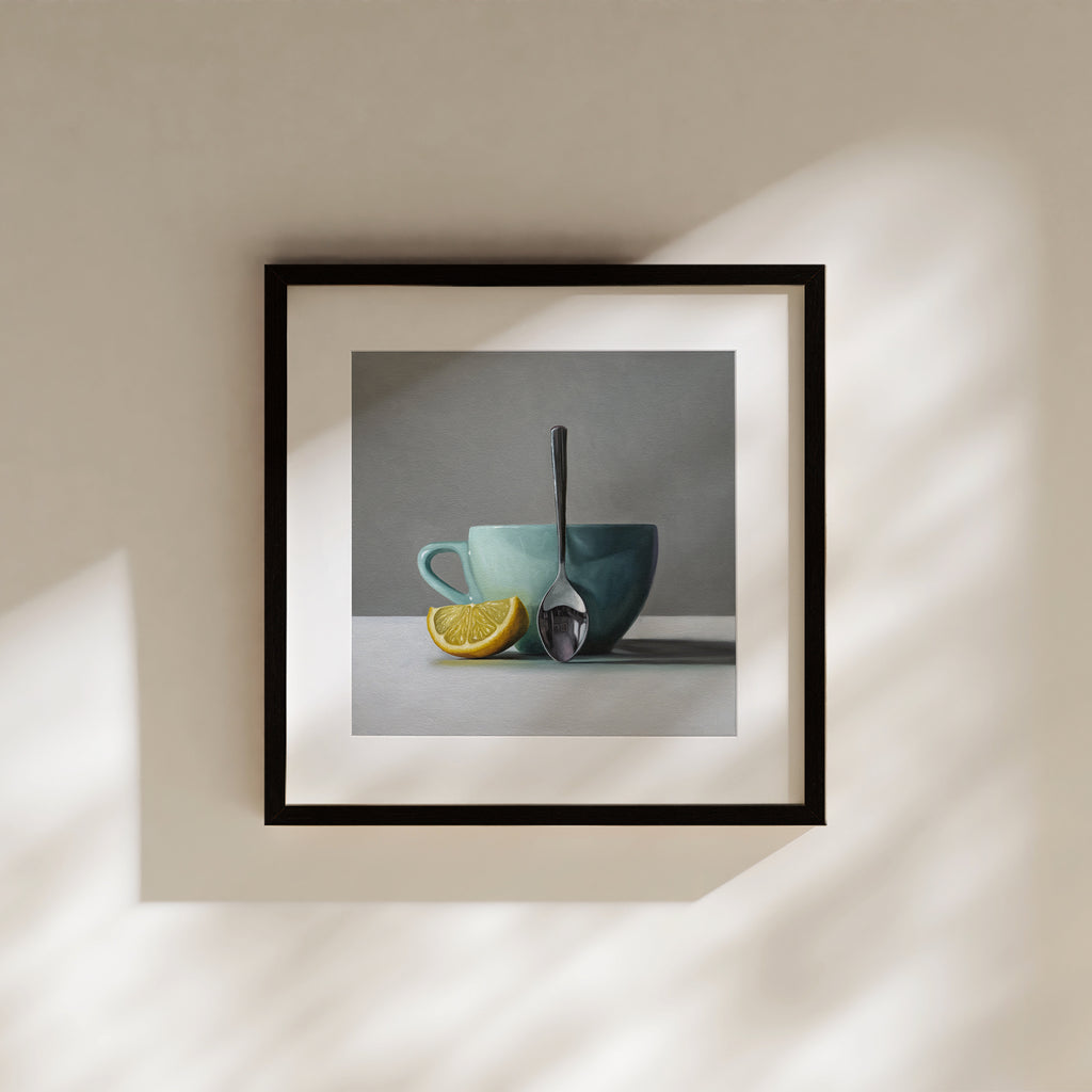 This artwork features a white lemon wedge, light blue cup and teaspoon.