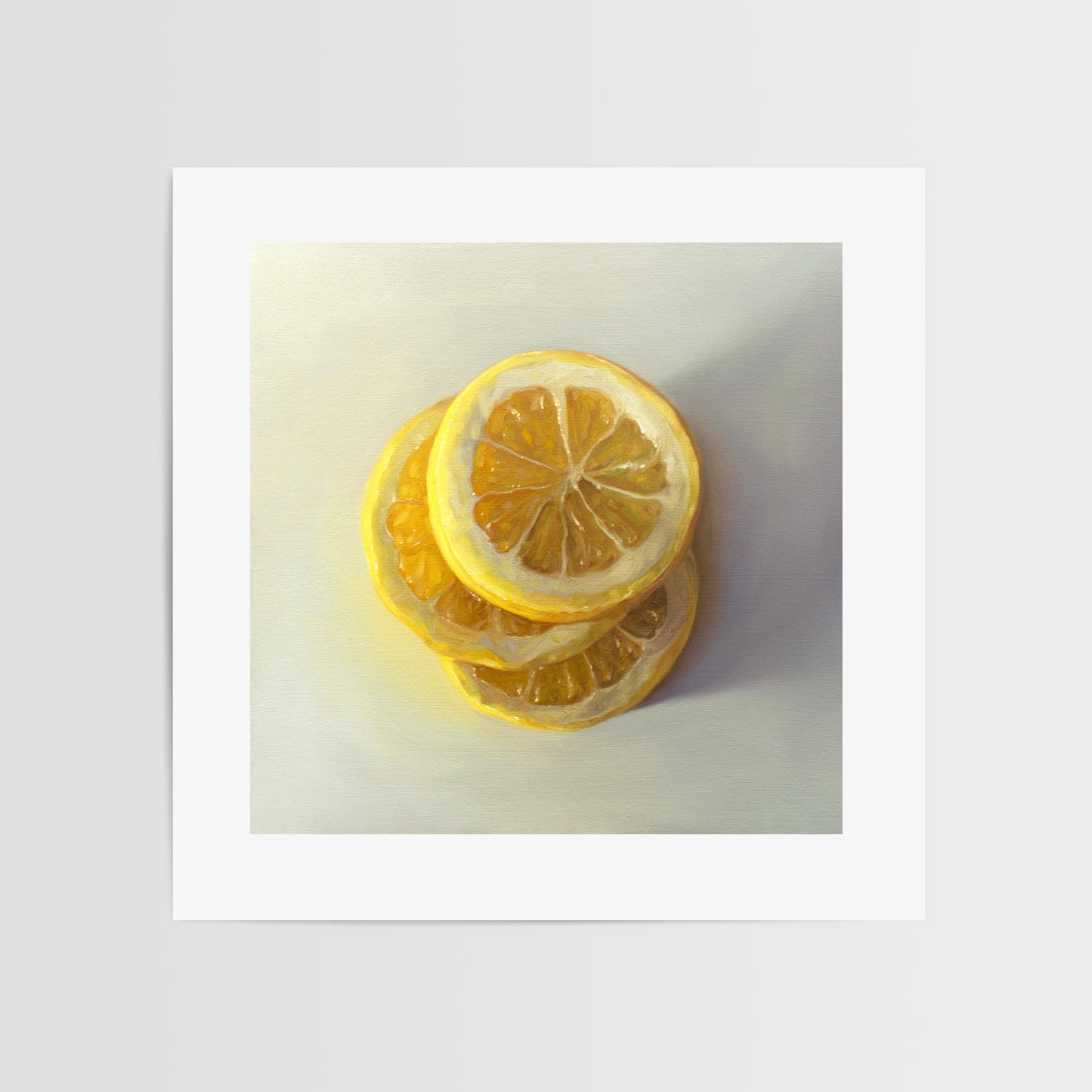 This artwork features a trio of lemon slices stacked on one another.