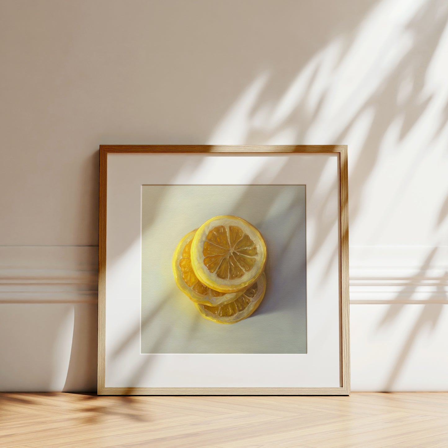 This artwork features a trio of lemon slices stacked on one another.