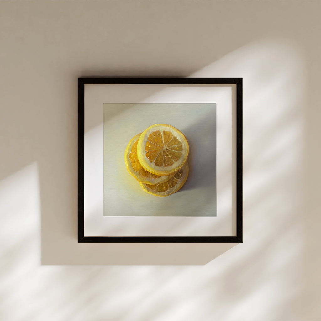 This artwork features a trio of lemon slices stacked on one another.