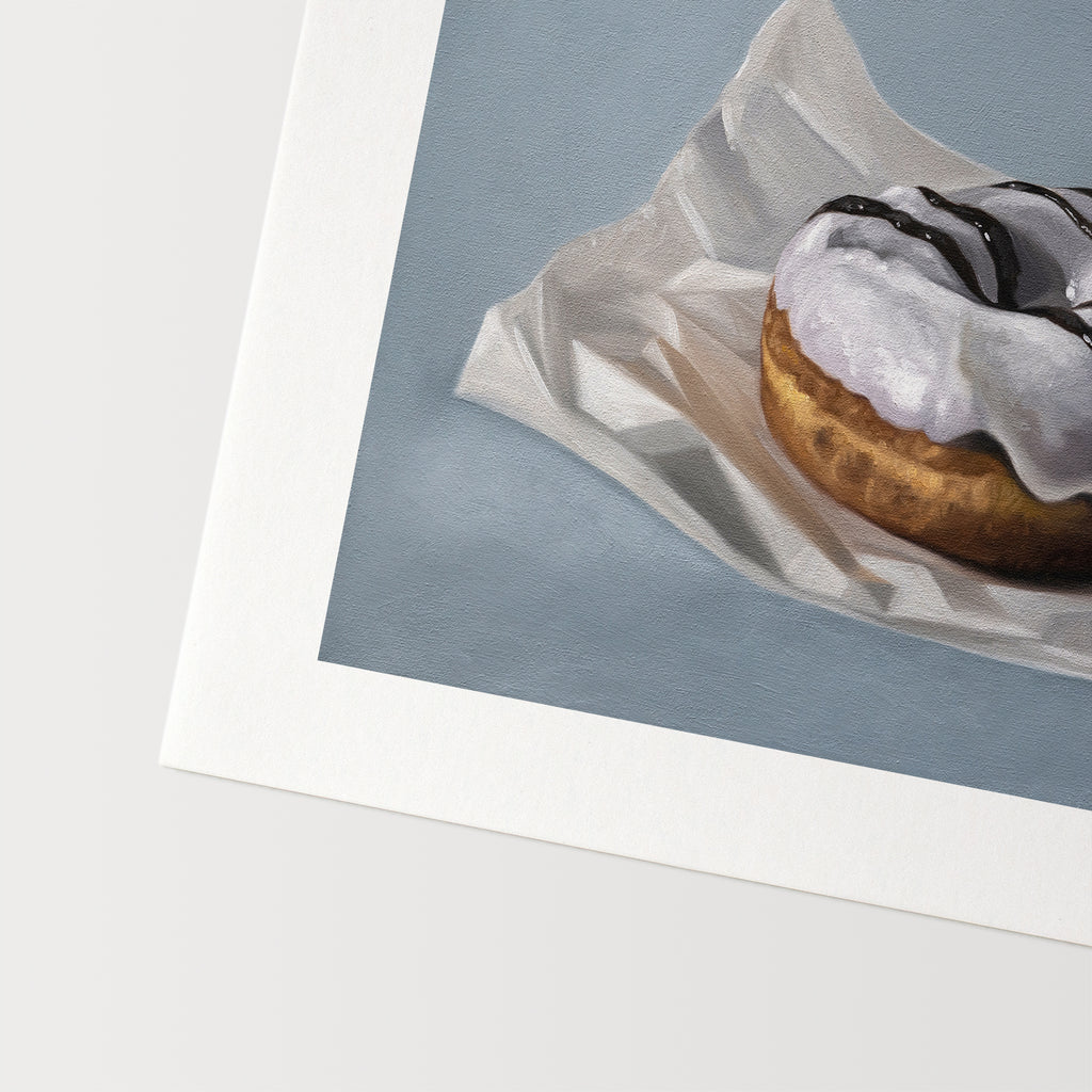 This artwork features a single iced donut resting on a piece of crumpled wax paper resting on a light blue surface.