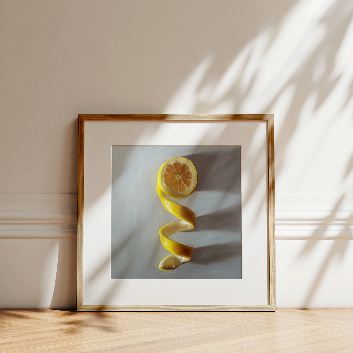 This artwork features a lemon half with its peeling twisting downward.