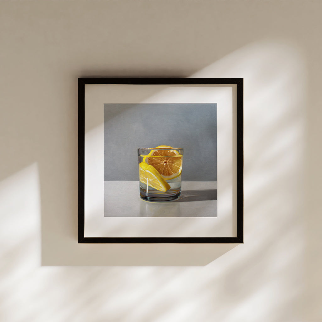 This artwork features a short glass of gin and tonic with two slices of lemon.