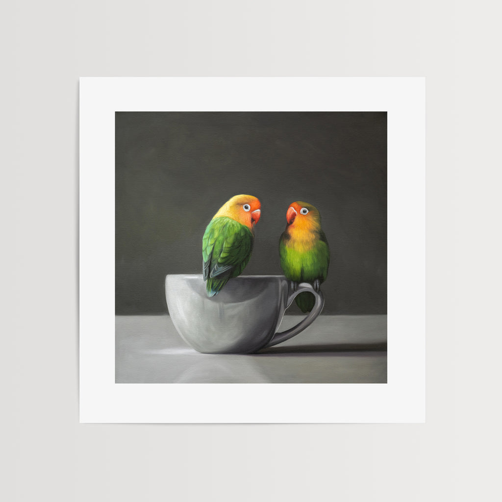 This artwork features a pair of Fischer’s Lovebirds perched on a white porcelain cup.