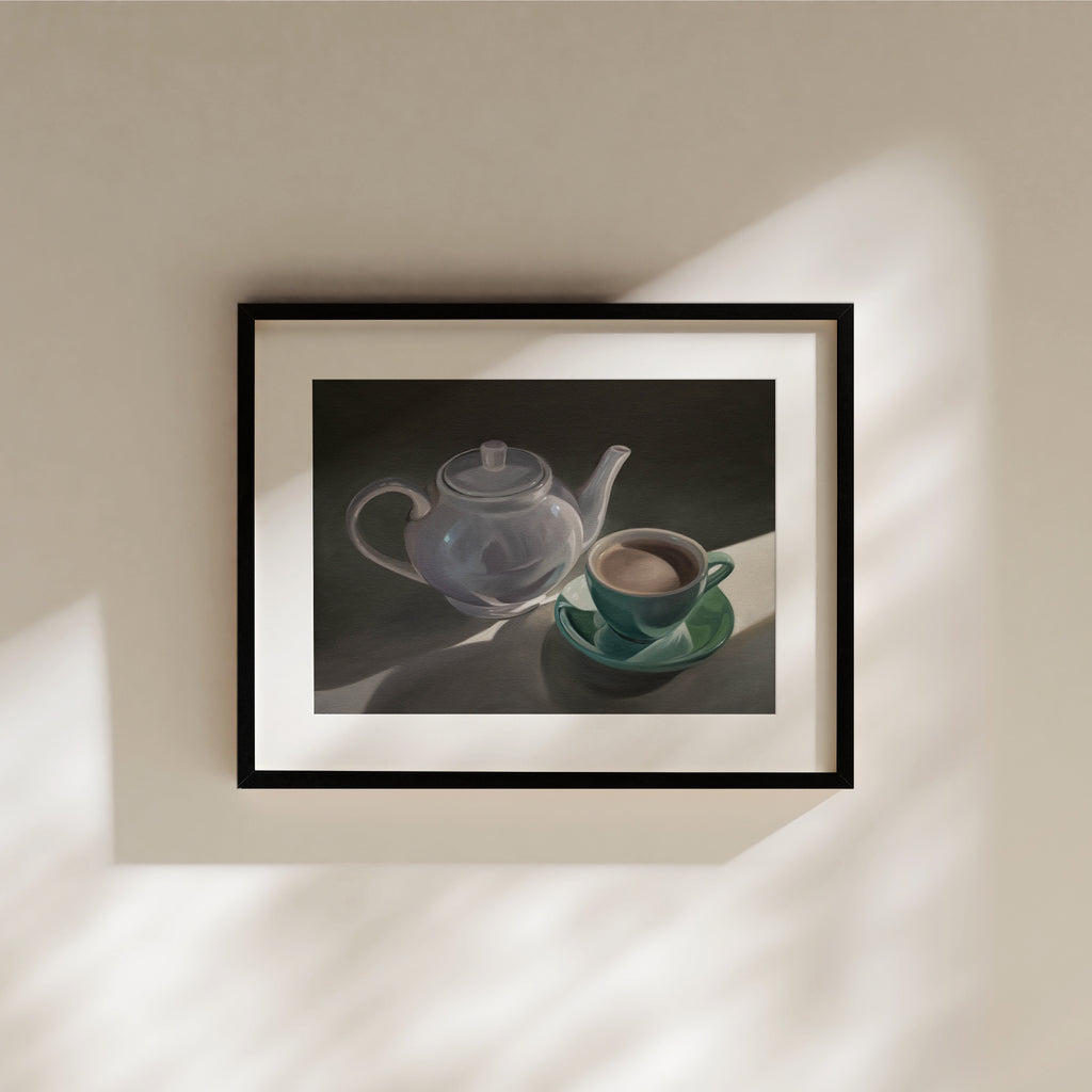 This artwork features a white teapot and green cup with saucer resting in some nice morning light peeking in through a window.