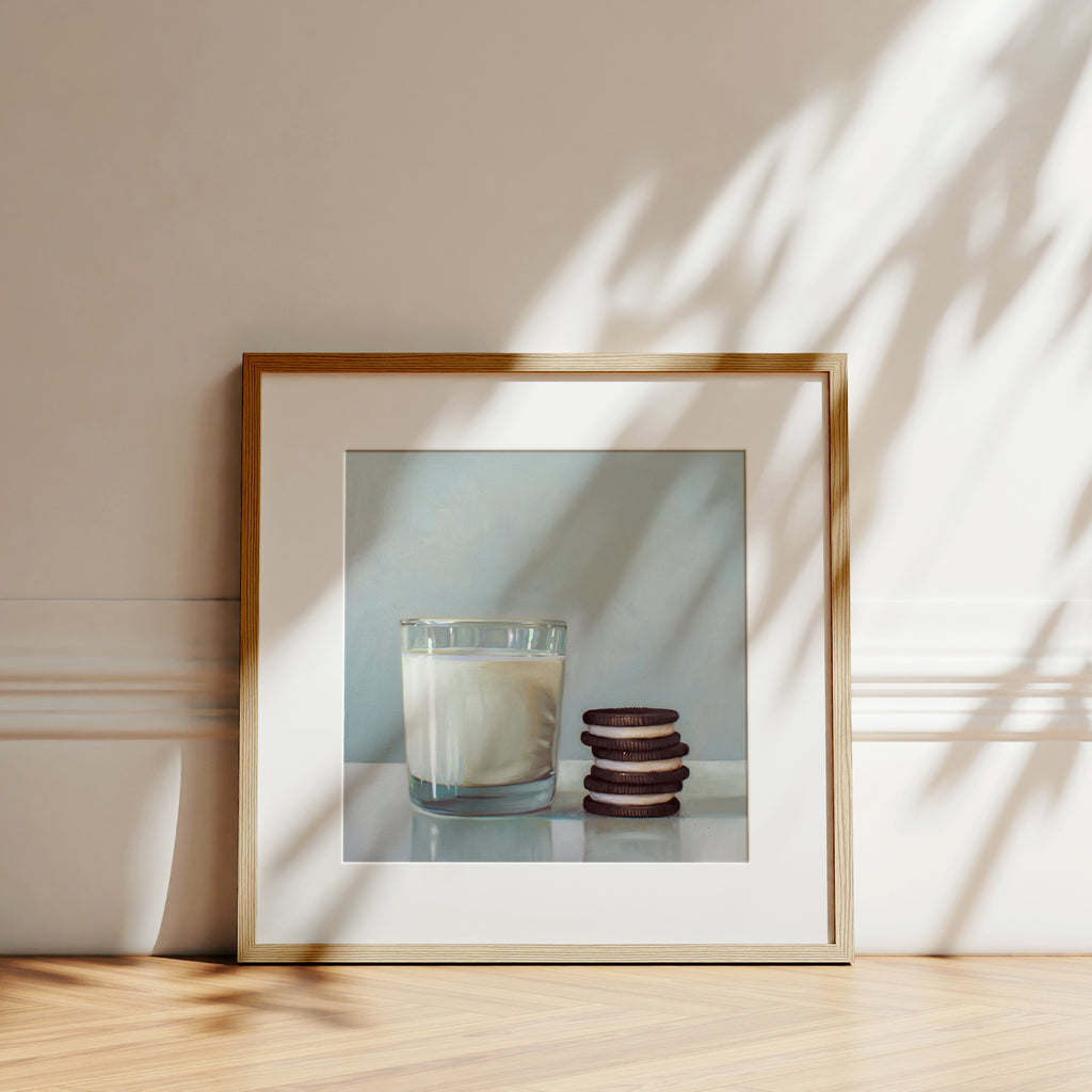 This artwork features a glass of milk and a trio of Double Stuff Oreos on a light, reflective surface with dramatic lighting and cast shadows.