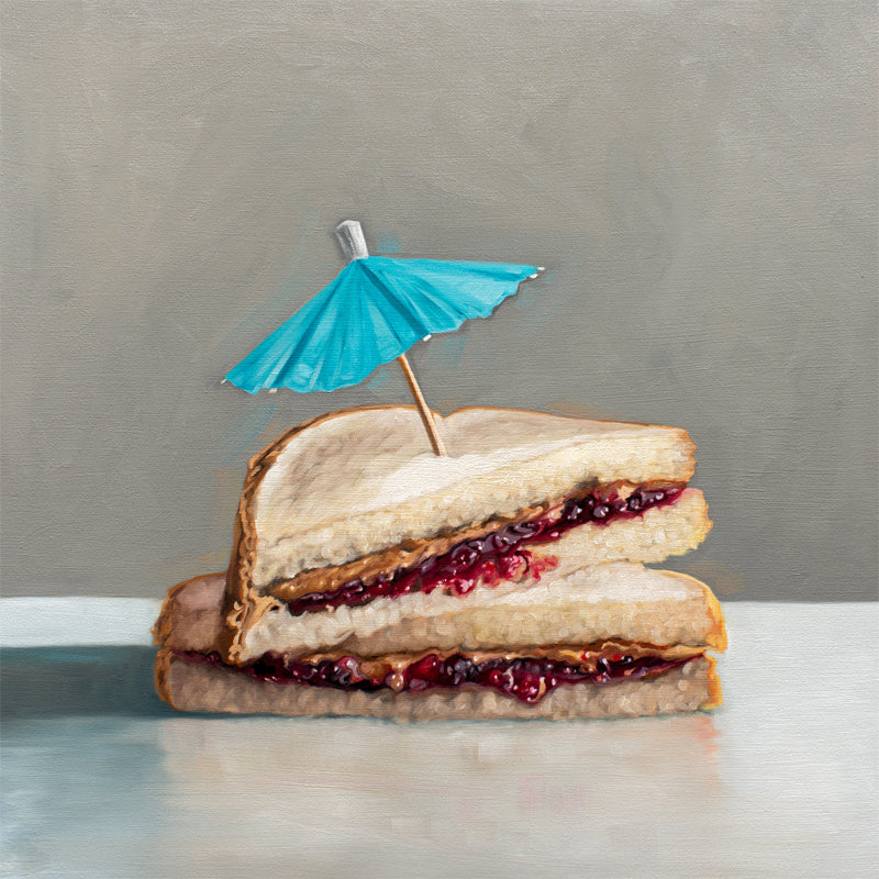 This artwork features a classic peanut butter and jelly sandwich basking under the shade of a cocktail umbrella.