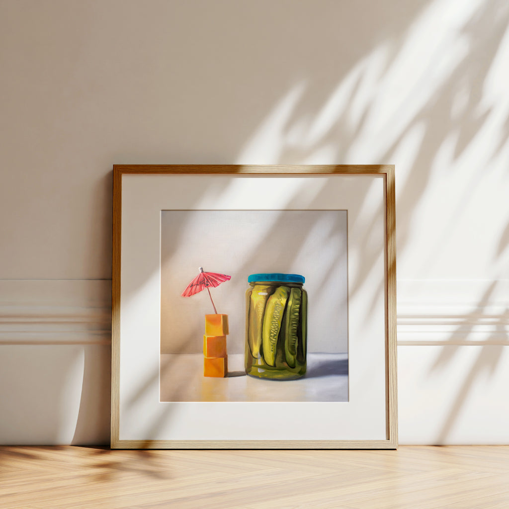 This artwork features a glass jar of pickles alongside a stack of cheese cubes relaxing under a drink umbrella.