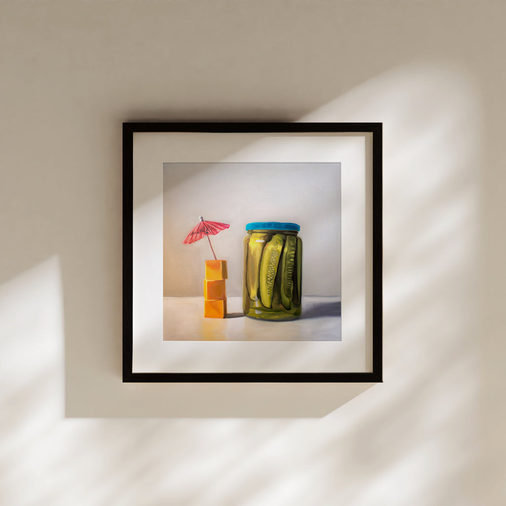 This artwork features a glass jar of pickles alongside a stack of cheese cubes relaxing under a drink umbrella.