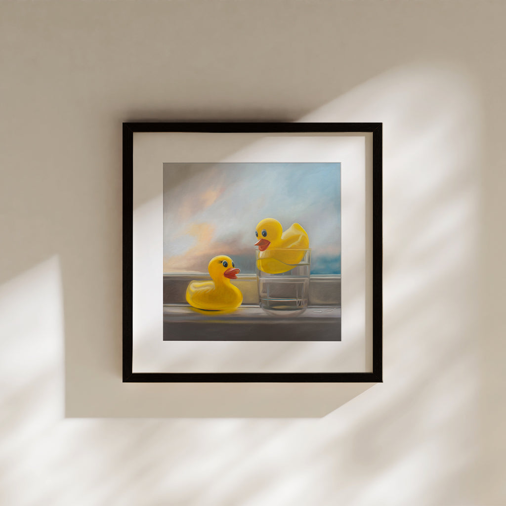 This artwork features a pair of yellow rubber duckies enjoying a swim in their pool, which in their case happens to be a glass of water!