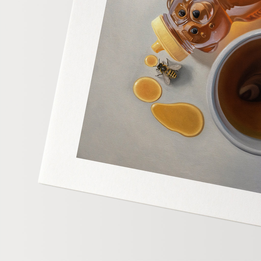 This artwork features a pair of honey bees inspecting a tipped honey bear bottle resting next to a cup of tea.