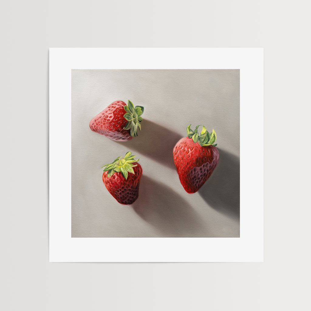 This artwork features a trio of bright red strawberries resting on a neutral grey surface with dramatic light and shadows.