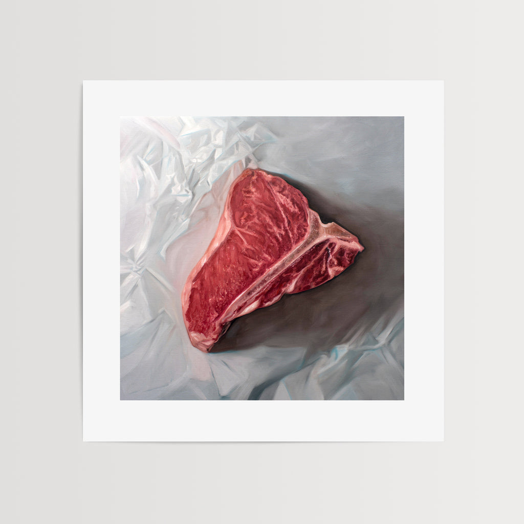This artwork features a fresh t-bone resting upon a crinkled white wax paper sheet.