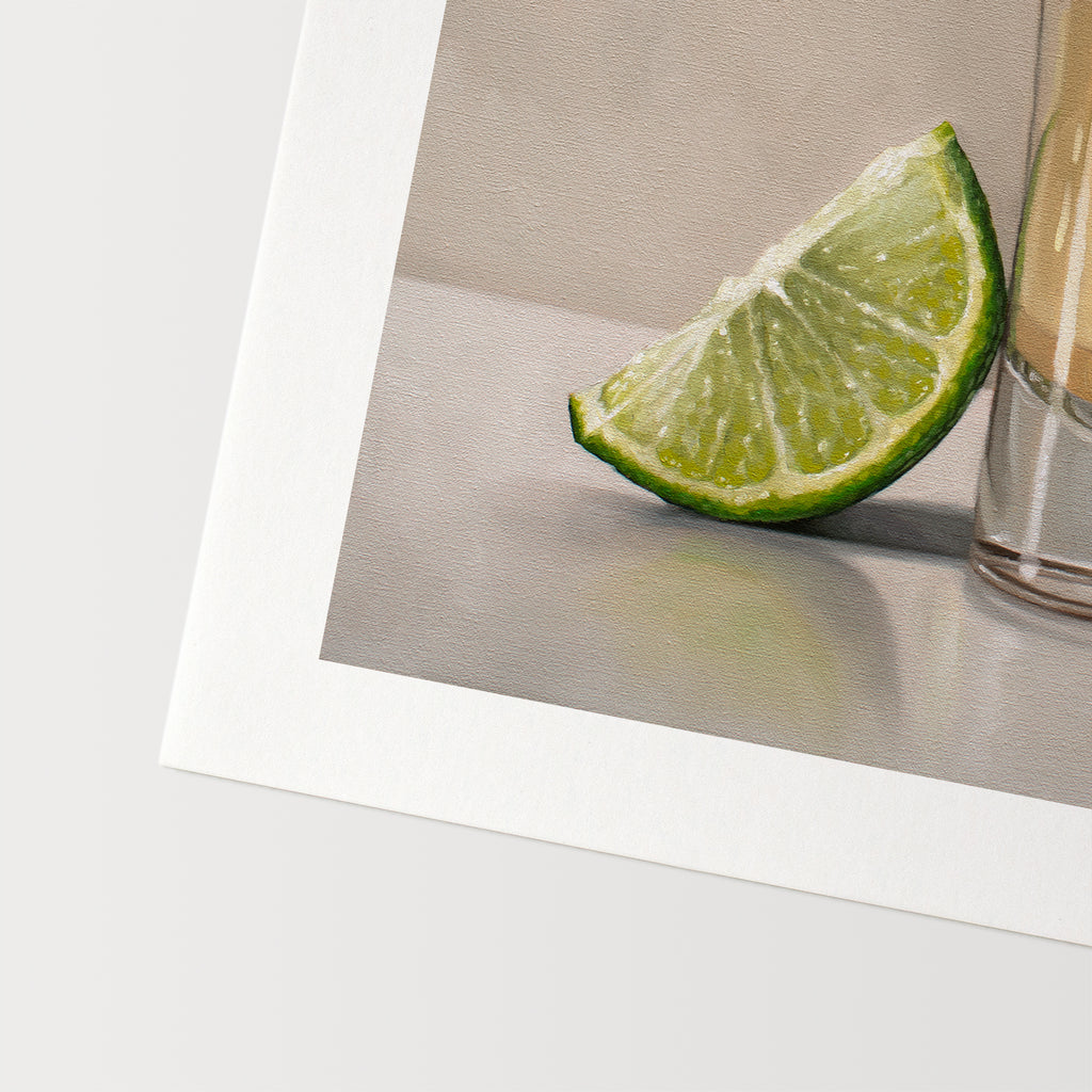 This artwork features a freshly sliced lime leaning on a golden shot of tequila.