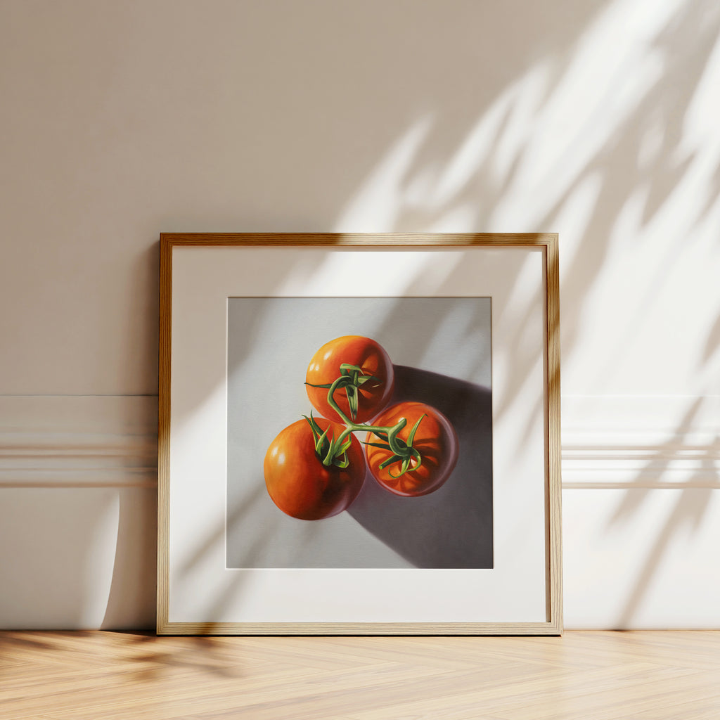 This artwork features a trio of tomatoes on the vine from above with some nice dramatic lighting.