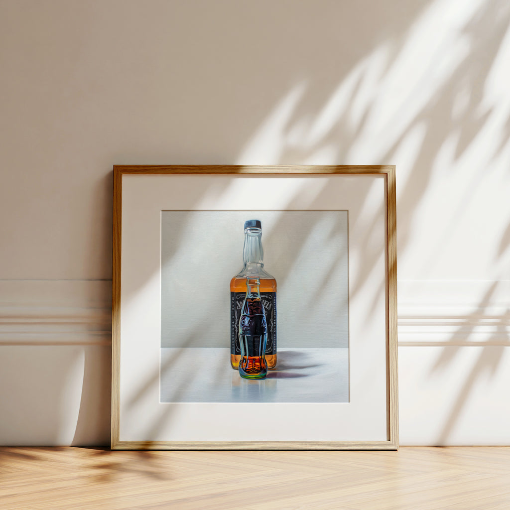 This artwork features a glass bottle of cola sitting in front of a bottle of whiskey.