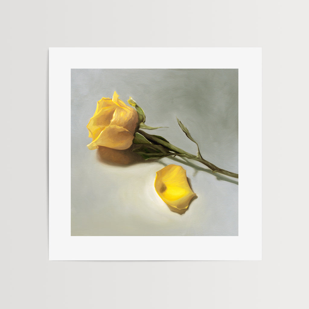 This artwork features a single yellow rose and petal laying on its side.